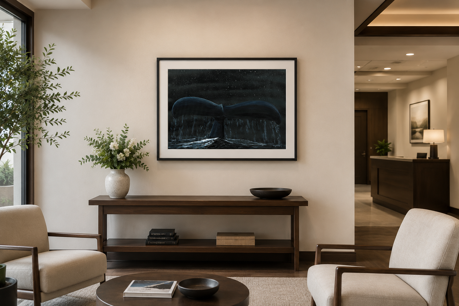 A framed Wyland whale artwork displayed in a serene funeral home lounge