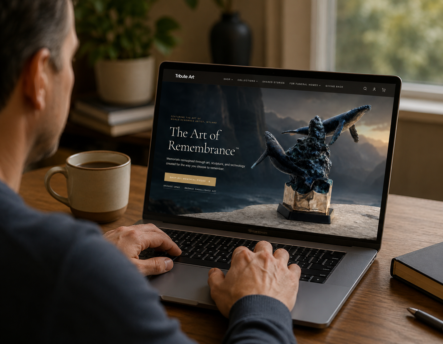 Tribute Art website displayed on a laptop in a cozy home setting