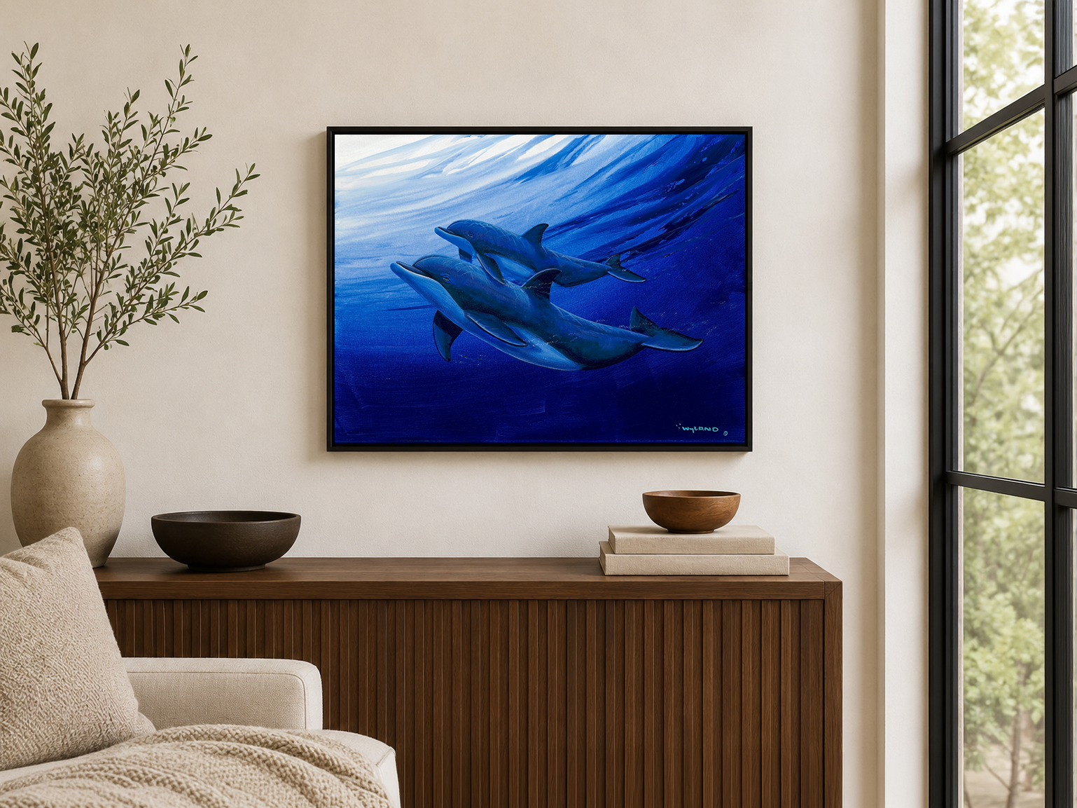 Two dolphins swimming beneath a wave, painting by Wyland